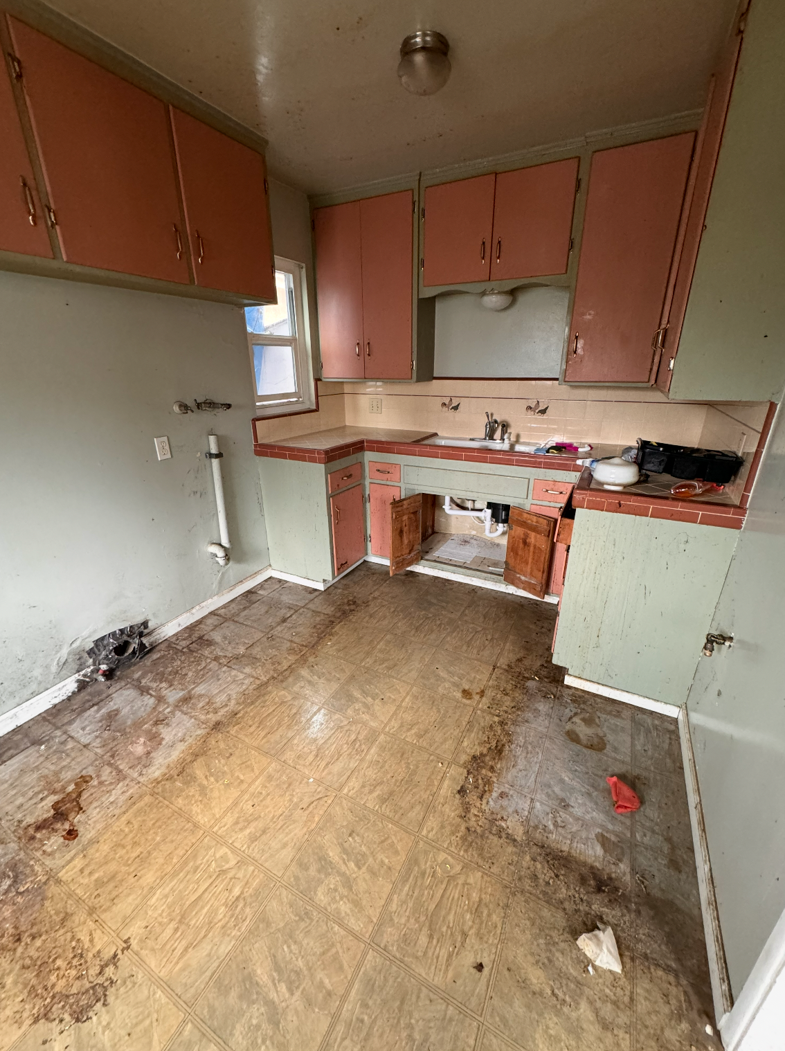 Severely damaged kitchen before restoration